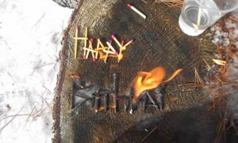Delighted birthday in matchsticks burning in Reverse